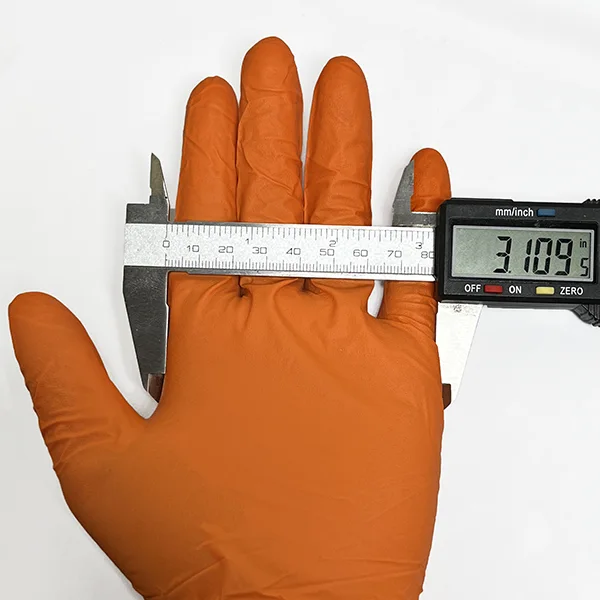 Nitrile glove hand width measured with a caliper