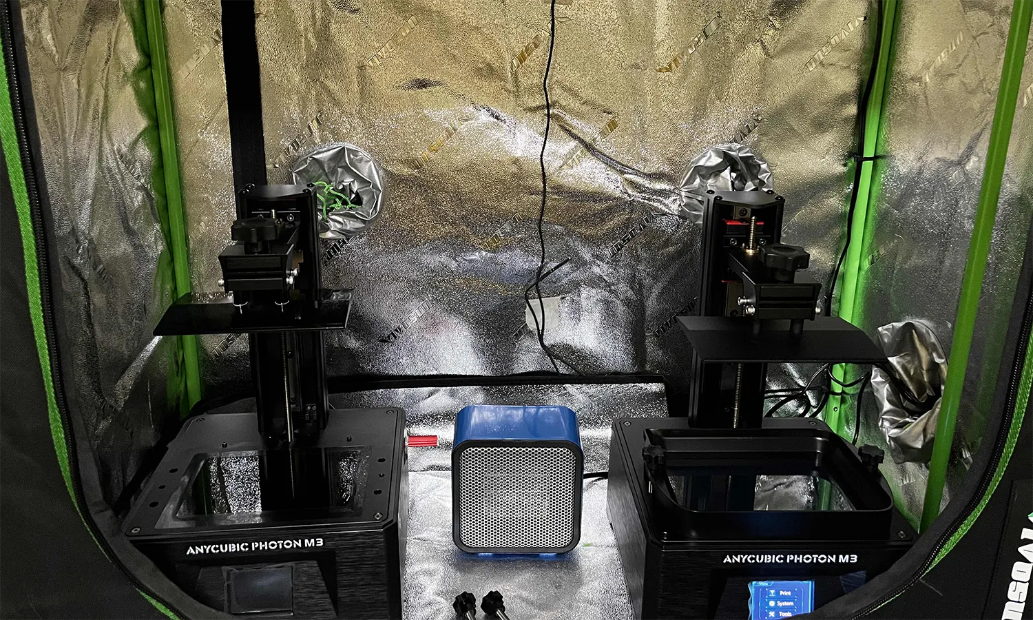 Example resin setup by 4D Filtration with a grow tent with a heater and two resin printers